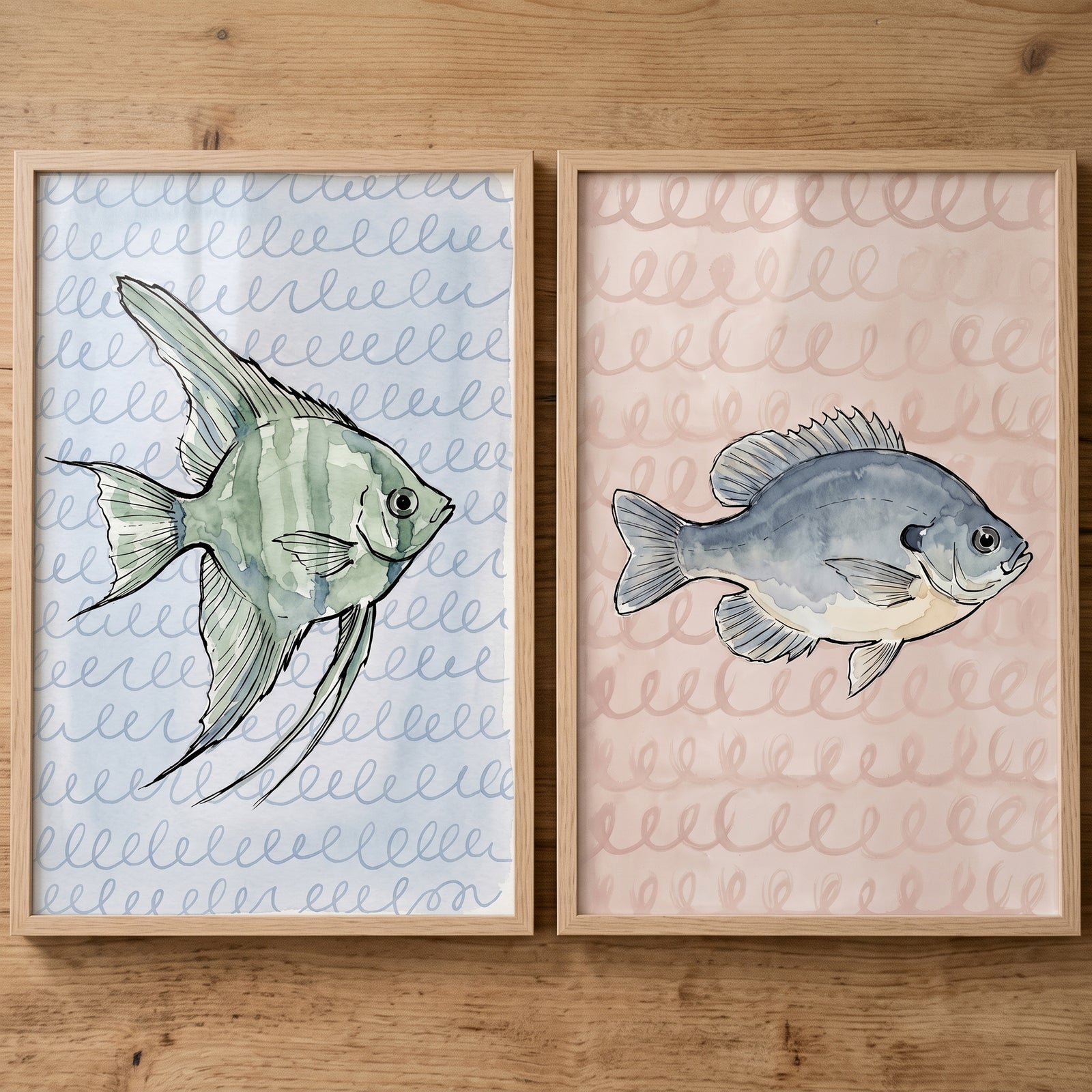 Loopy pattern watercolor fish wall art set of 2 with green and blue fish on wavy backgrounds in light wood frames.