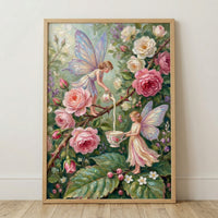 A framed vertical artwork depicts an enchanting scene with two fairies amidst a lush garden of roses. The upper fairy, with delicate iridescent blue and purple wings, balances on a thorny rose branch and pours a stream of milk from a small floral-patterned pitcher. 