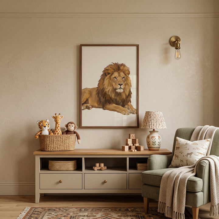Majestic golden mane lion wall art in a neutral nursery with a wooden sideboard, stuffed toys, and a green armchair.