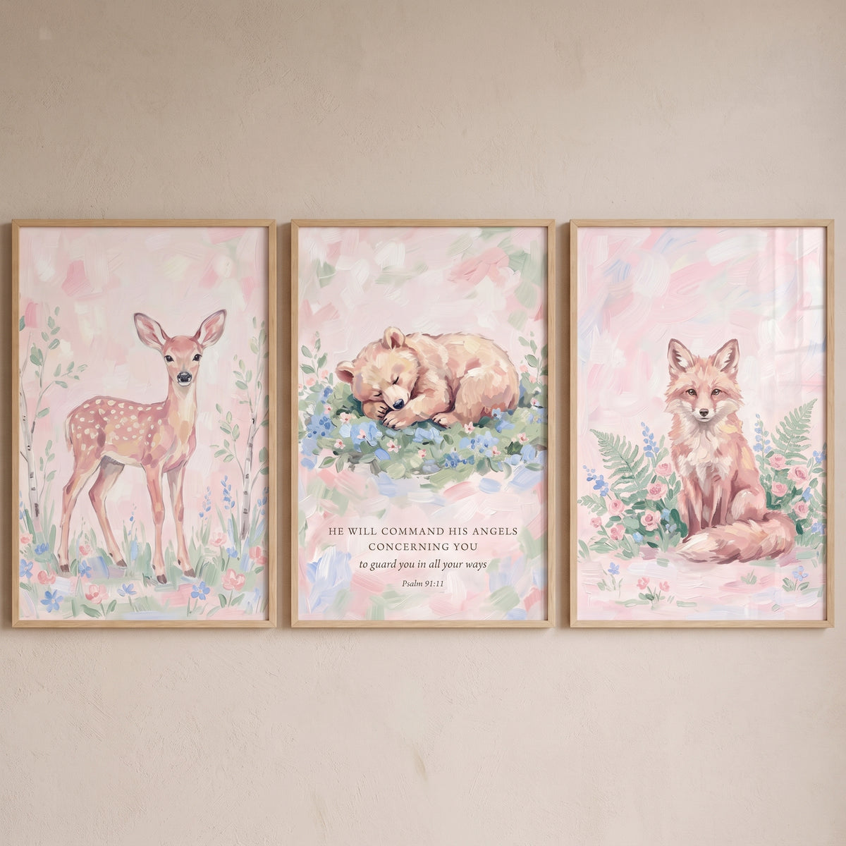 Meadow bloom woodland animals wall art set of 3 with a deer, sleeping bear with Psalm 91:11, and a fox in a pink meadow.