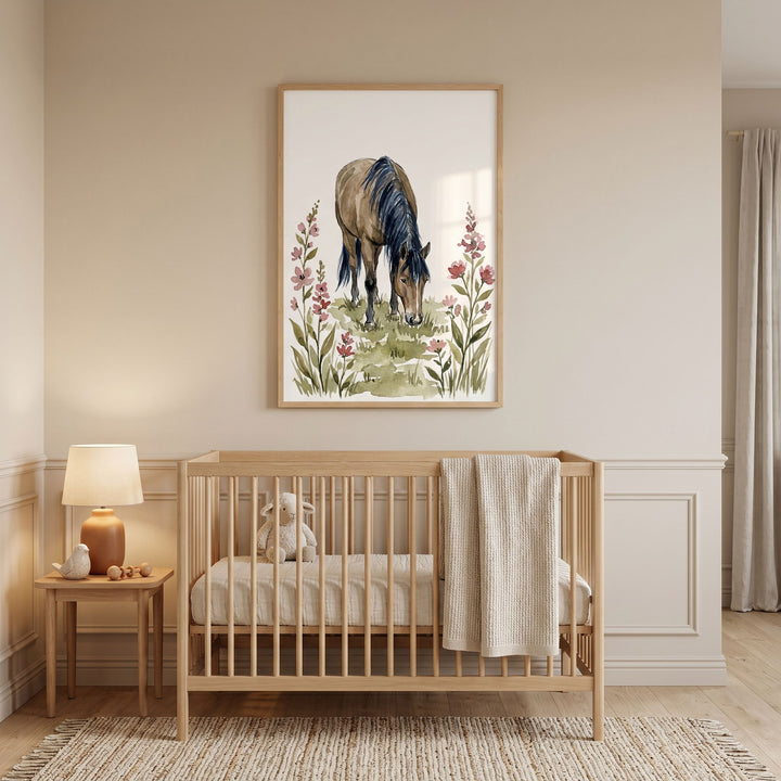 Meadow grazing horse wall art hangs above a wooden crib with a stuffed lamb in a neutral nursery room.