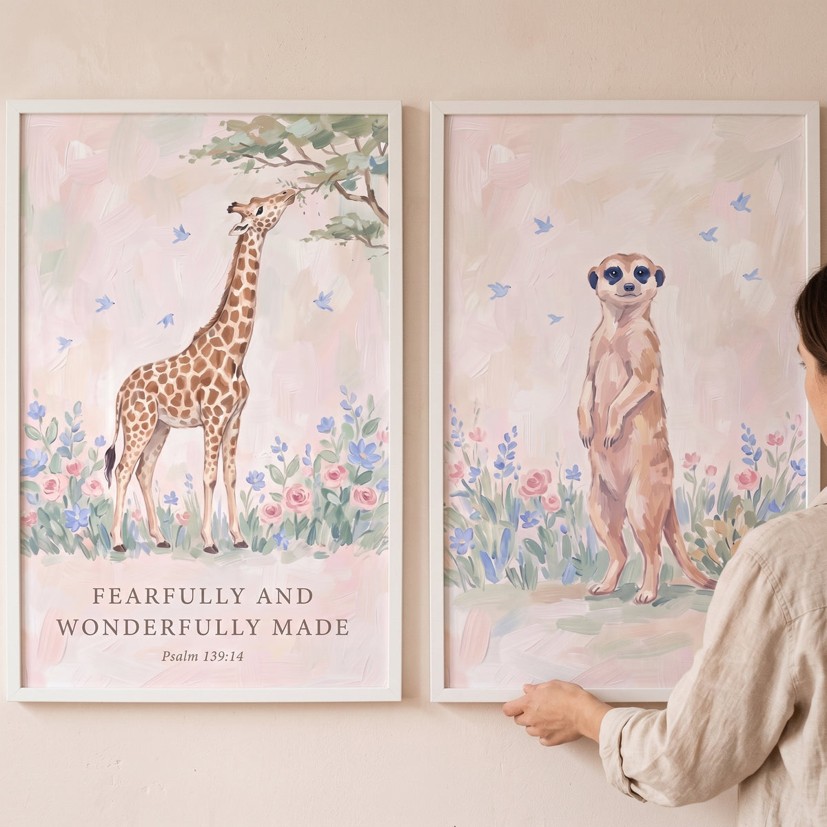 Meadow wildflower safari animals wall art set of 2 featuring a giraffe and meerkat among pastel flowers and blue birds.