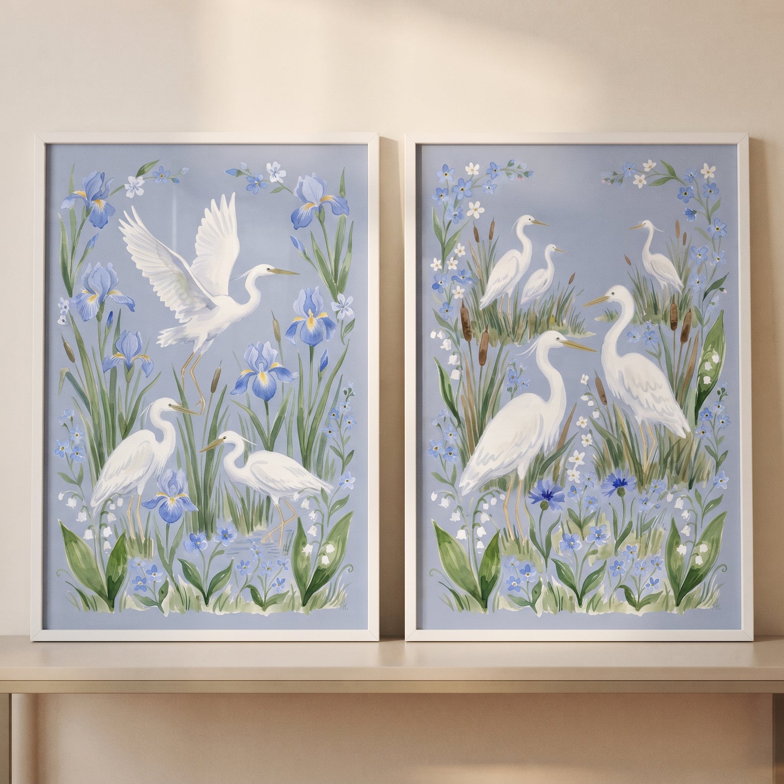 Meadow wildflower white egret bird wall art set of 2 features white egrets among blue irises and green foliage.