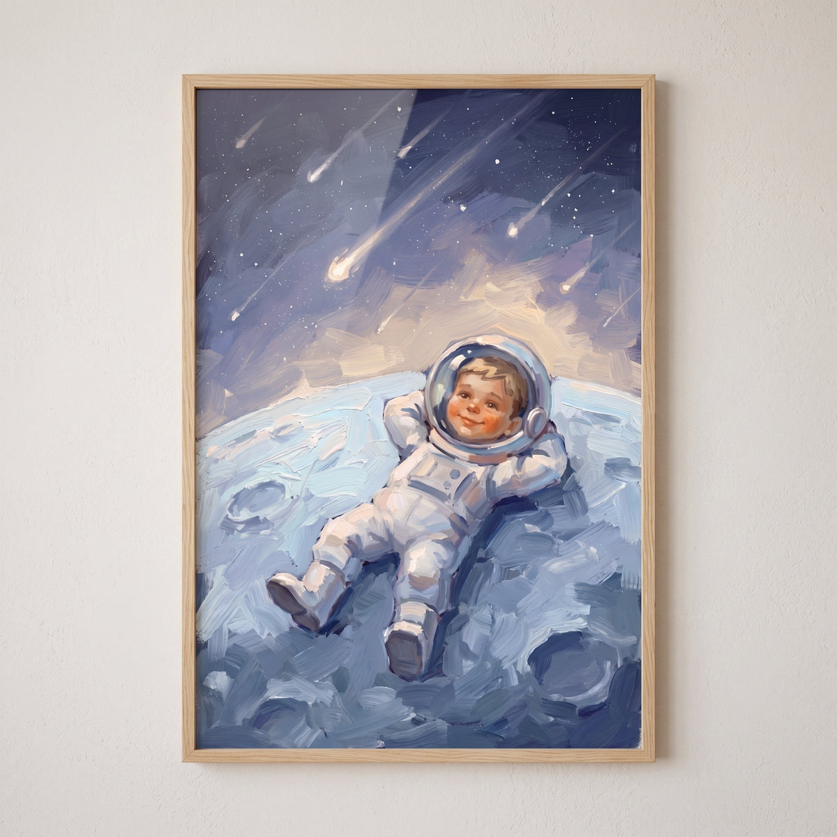 Meteor shower baby astronaut wall art depicts a child in a white spacesuit lying on the moon gazing at shooting stars.
