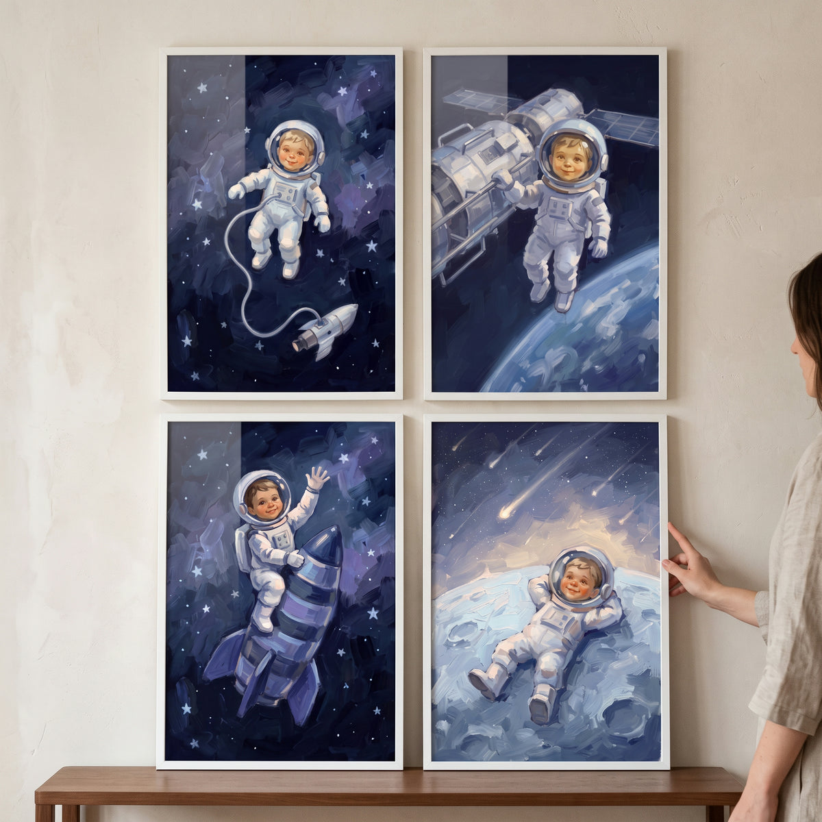 Midnight blue baby astronaut wall art set of 4 features a baby in a space suit exploring stars, rockets and the moon.