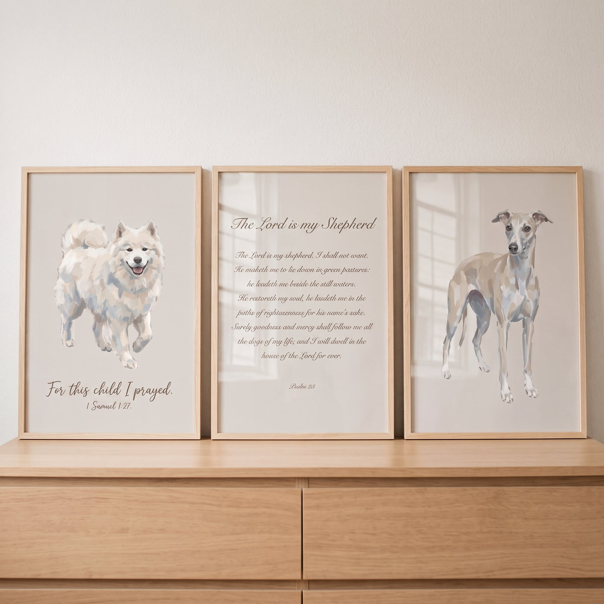 Minimalist beige religious dog wall art set of 3 featuring scriptures and dog illustrations on a wooden dresser.