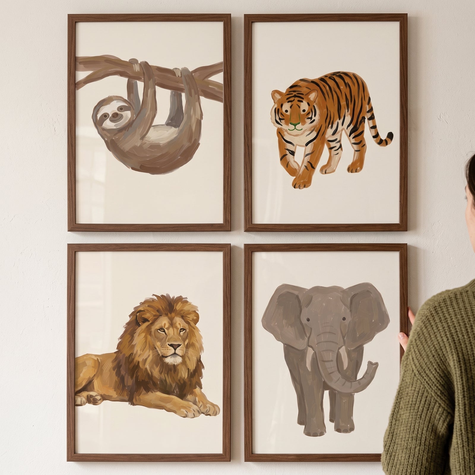 Minimalist beige safari animals wall art set of 4 featuring a sloth, tiger, lion, and elephant in wood frames.