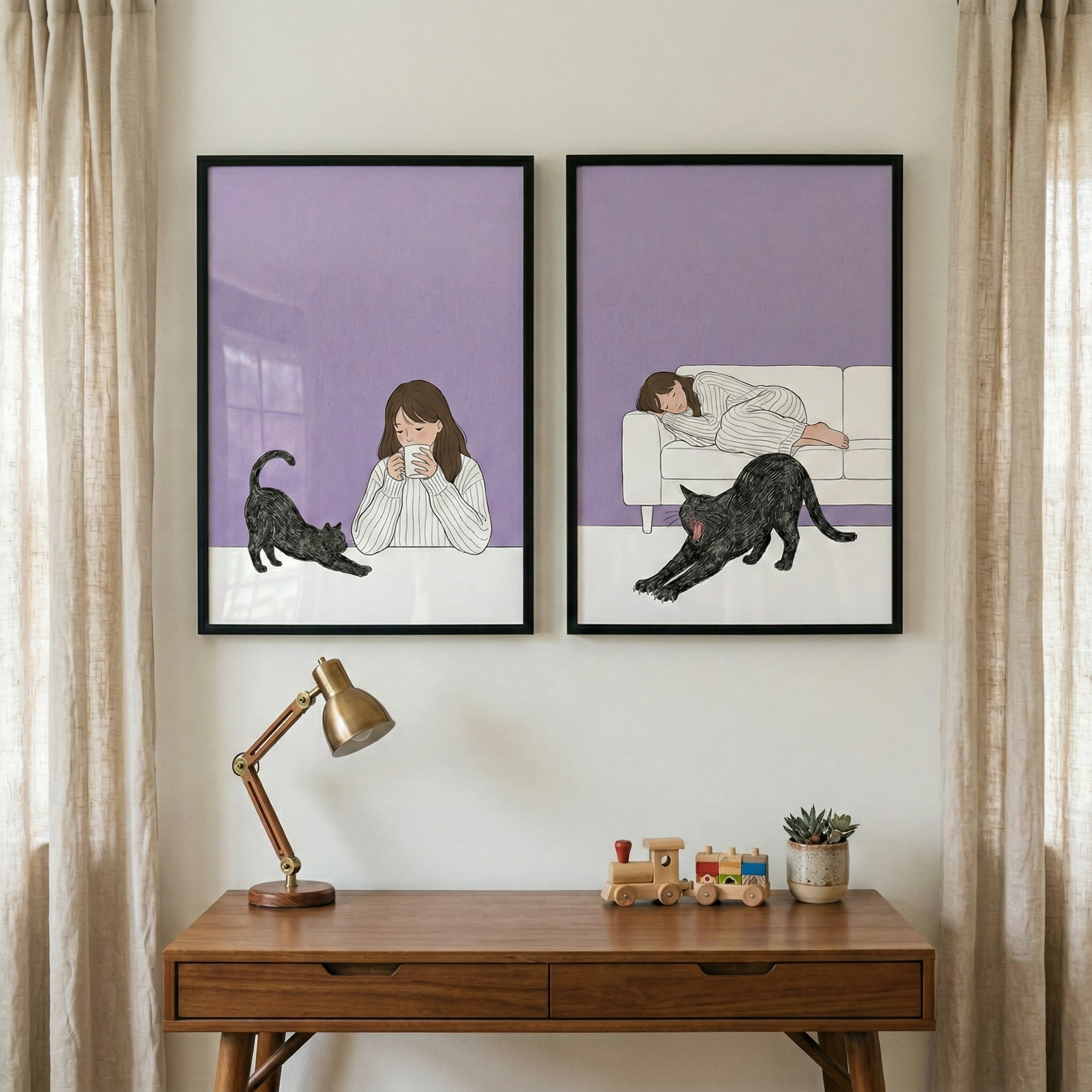 Two framed illustrations hang above a wooden desk between beige curtains. One shows a woman in a striped sweater holding a mug beside a stretching black cat, and the other shows the same woman asleep on a white couch while the black cat stretches in front of her against a soft purple background.