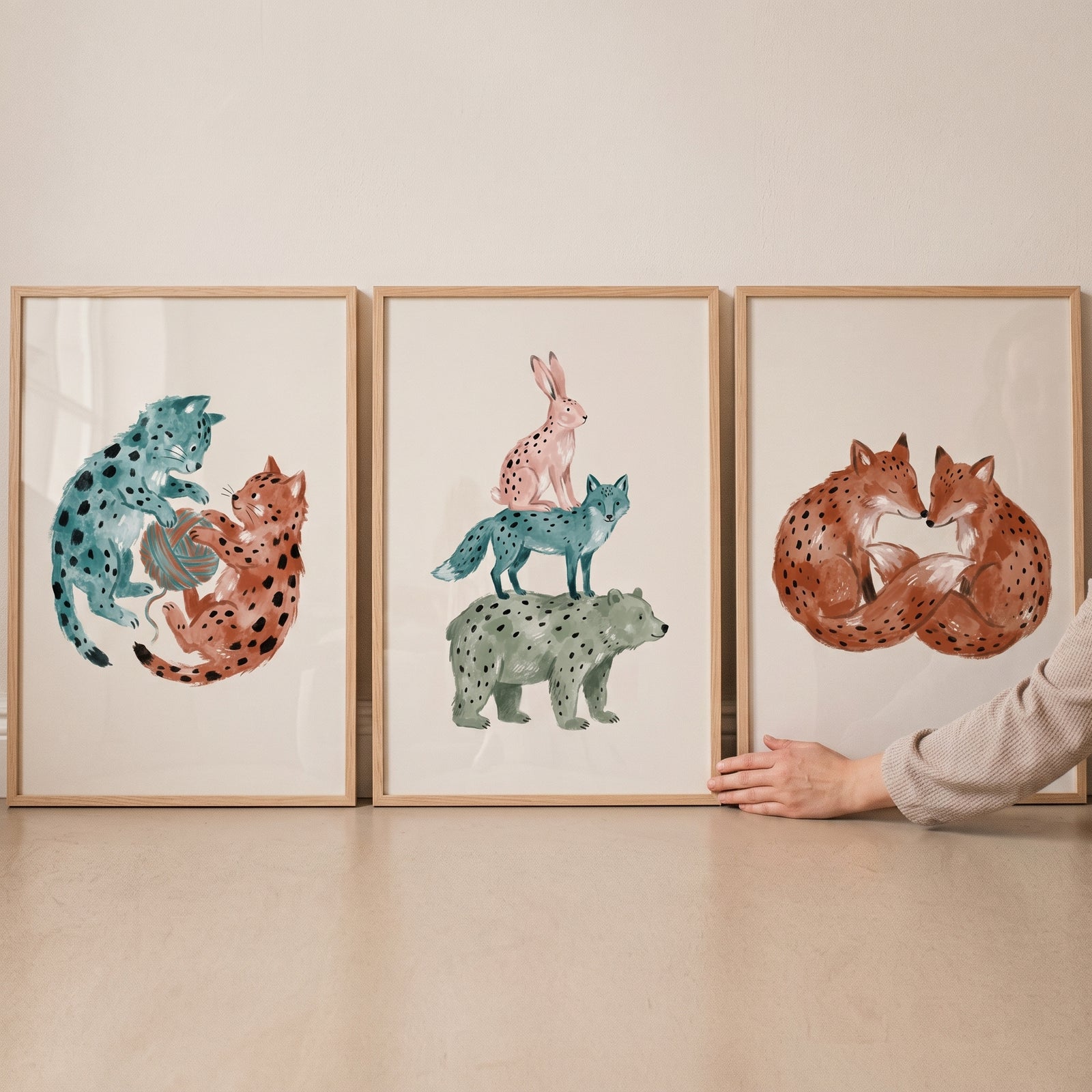 Minimalist black dot animal wall art set of 3 featuring cats, a stack of forest animals, and two foxes in wood frames.