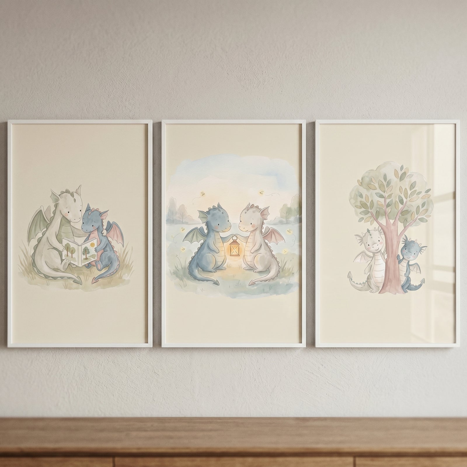 Minimalist boho baby dragons wall art set of 3 depicting two dragons reading, holding a lantern, and playing by a tree.