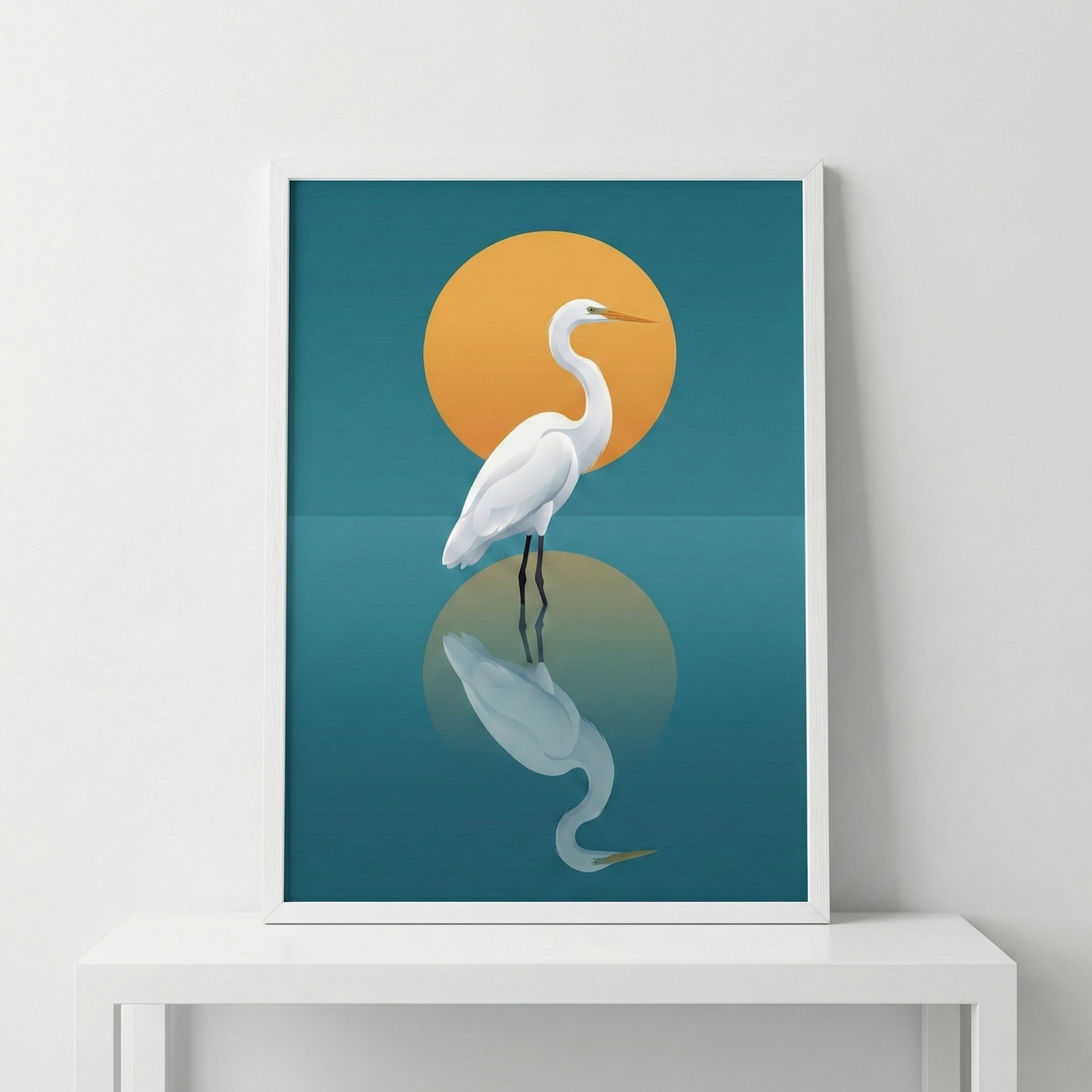 A framed piece of minimalist digital art featuring a white egret. A slender white bird with a long, curved neck and a sharp orange beak stands in calm water. Behind the bird is a large, vibrant orange circular sun against a deep teal backdrop. The lower half of the composition shows a clear reflection of the bird and the orange sun on the still water's surface. The illustration uses clean lines and simple shapes to create a serene, modern scene.