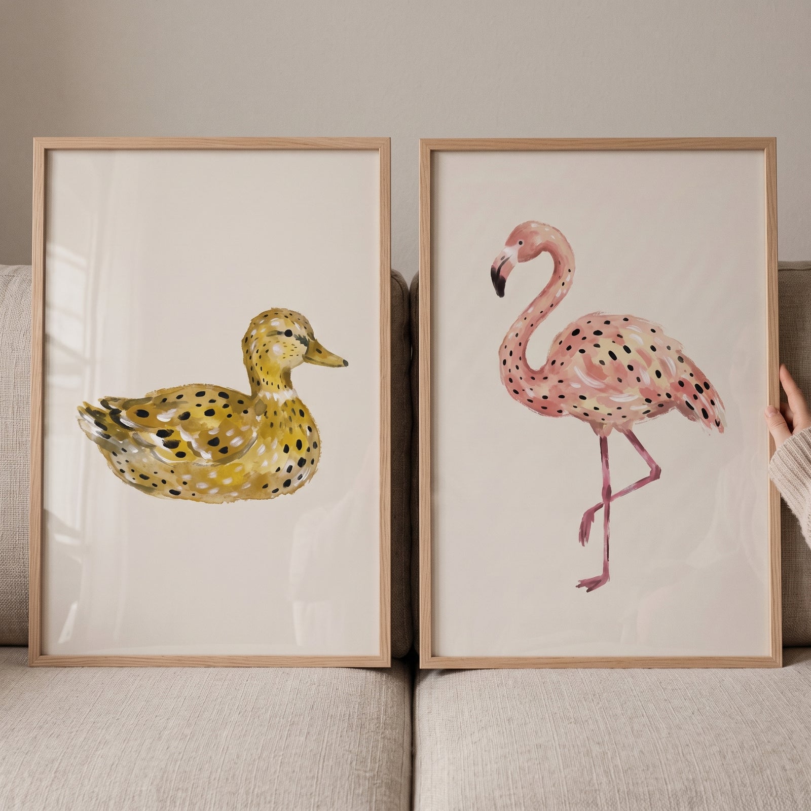 Minimalist stippled bird wall art set of 2 features a yellow spotted duck and a pink flamingo in wooden frames.