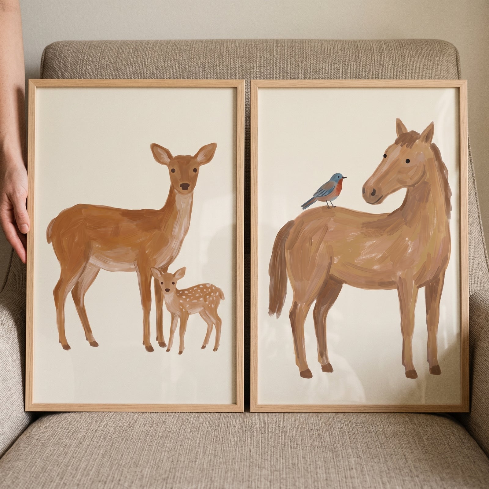 Minimalist tan brown animals wall art set of 2 featuring a deer with fawn and a horse with a blue bird.