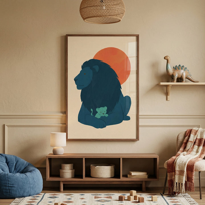 Framed illustration of a dark blue lion resting with a small cub nestled between its paws set against a warm red sun above a wooden console. The artwork anchors a cozy child’s room with soft textures toys and neutral decor surrounding it.