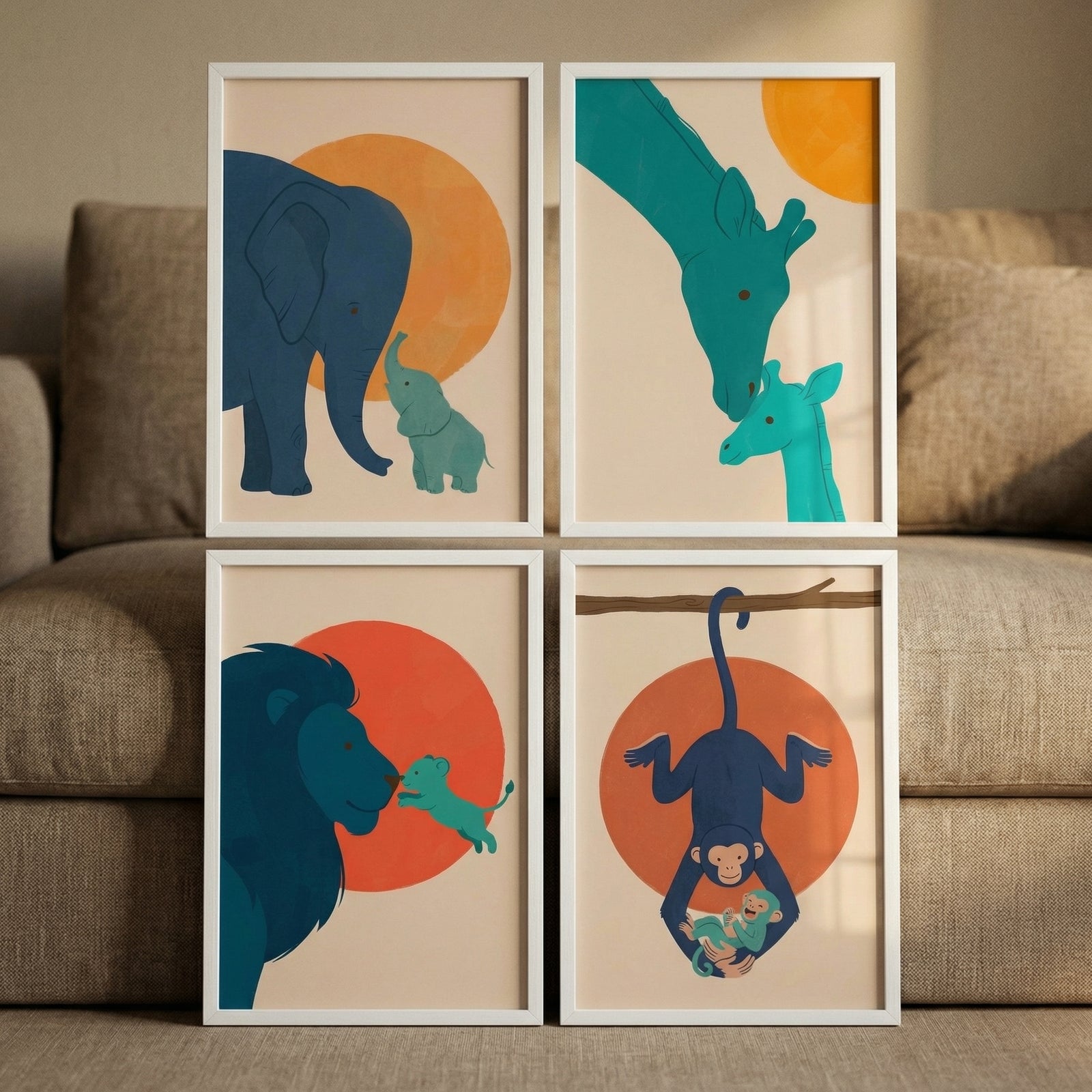 Four framed minimalist illustrations are displayed in a grid leaning against a sofa. Each piece features a parent and baby animal in shades of deep blue and turquoise against a neutral background with a large orange sun-like circle.