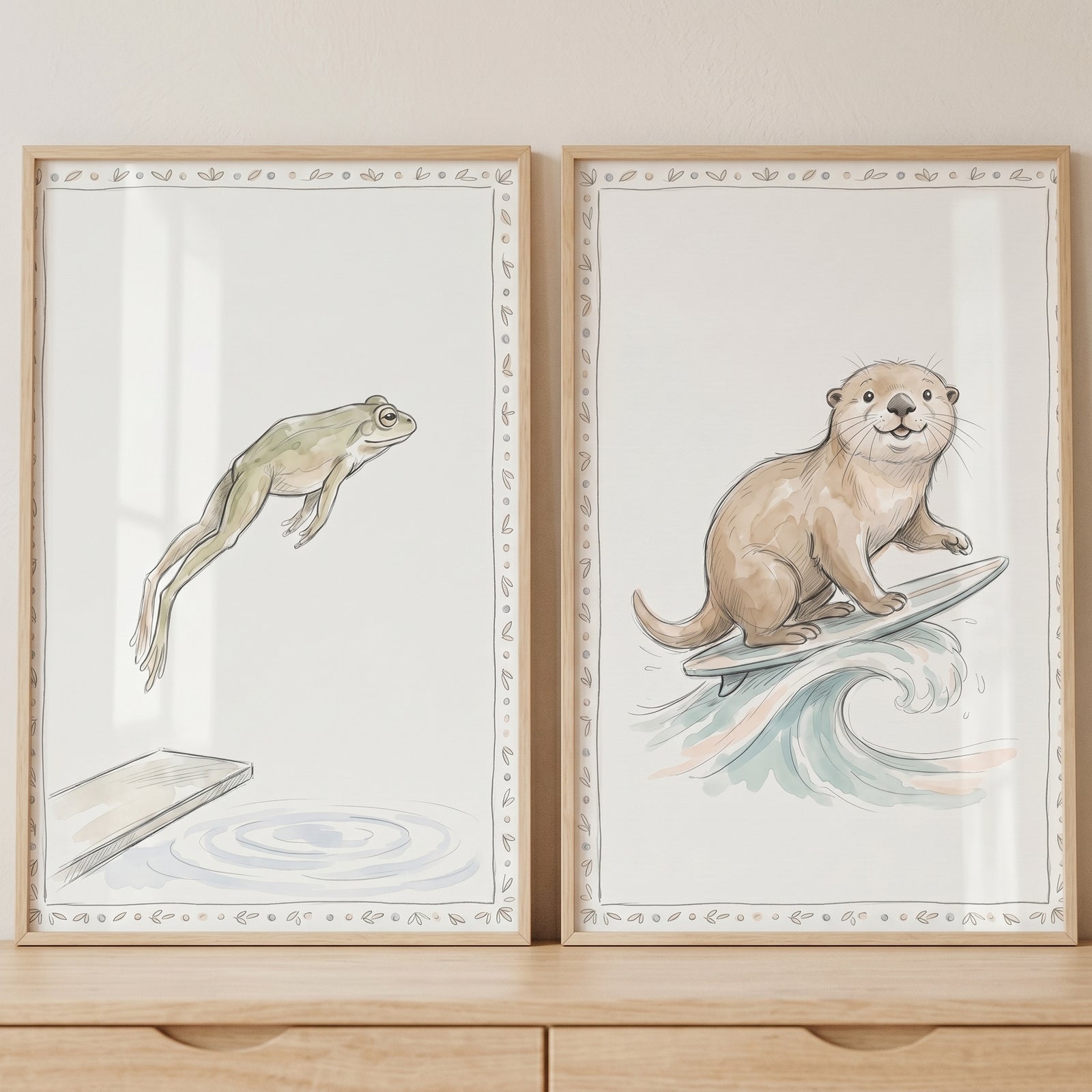 Minimalist watercolor athletic animals wall art set of 2 features a diving frog and a surfing otter in light wood frames.