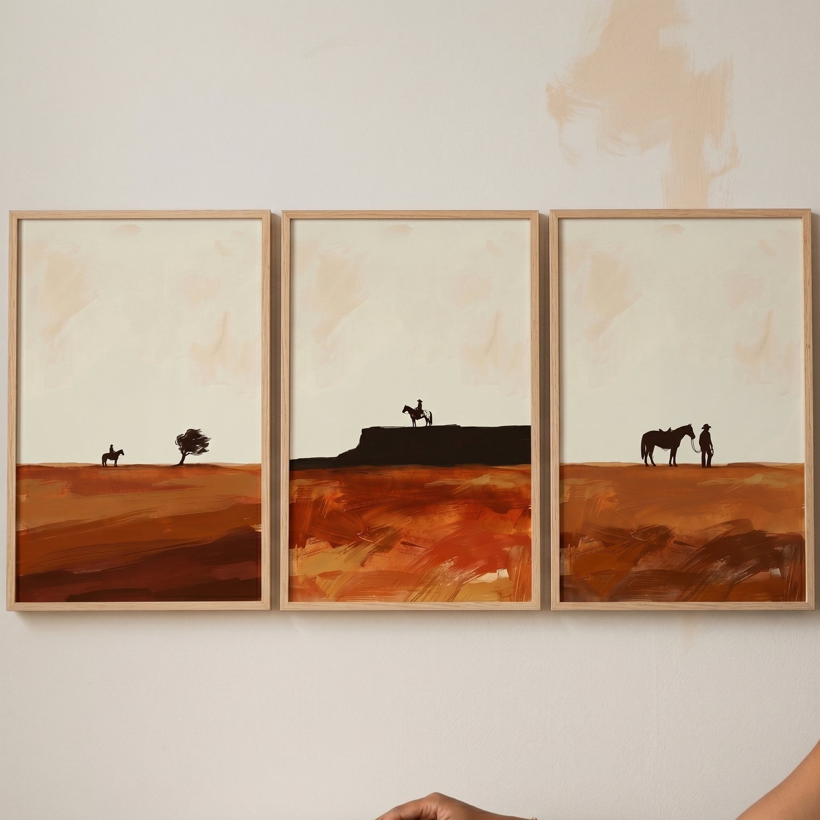 Minimalist western silhouette horse wall art set of 3 features riders across an earthy orange desert landscape.