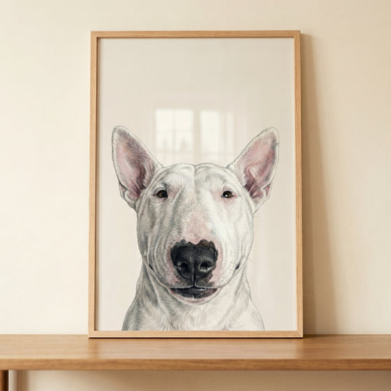 Minimalist white bull terrier wall art in a wooden frame rests on a table against a light beige wall.