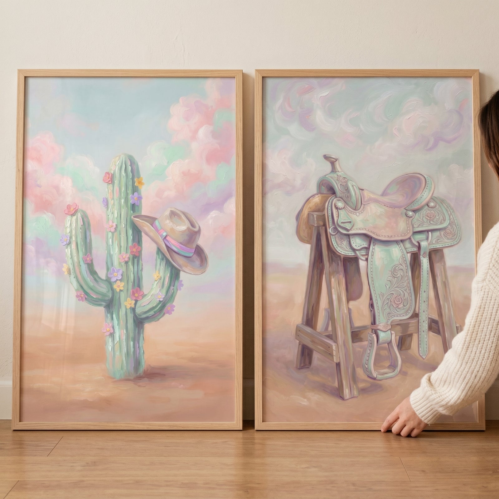 Mint lavender floral western wall art set of 2 showing a blooming cactus with a cowboy hat and a saddle on a stand.