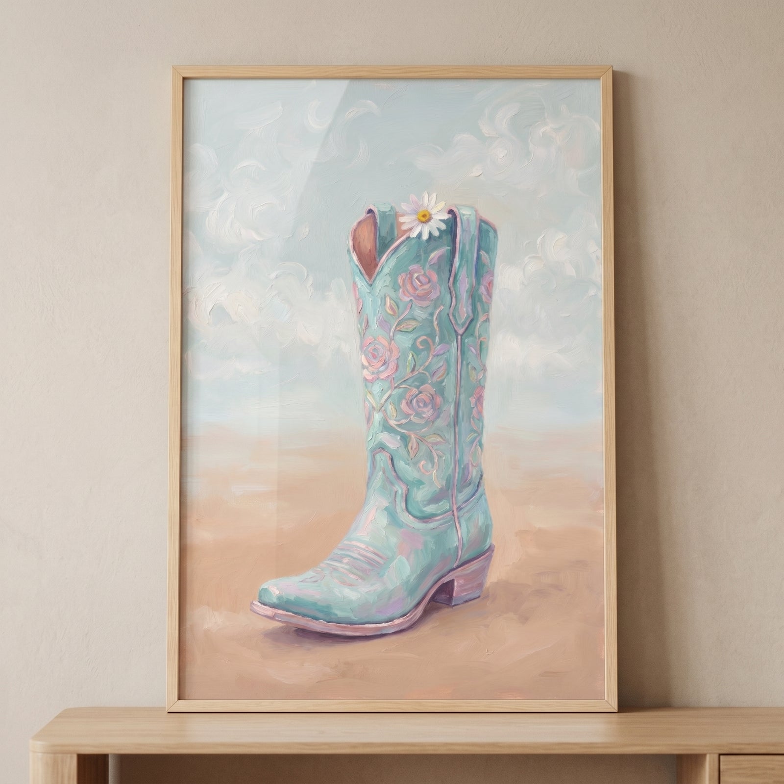Mint rose cowboy boot wall art featuring a light teal boot with pink roses and a daisy in a soft desert setting.