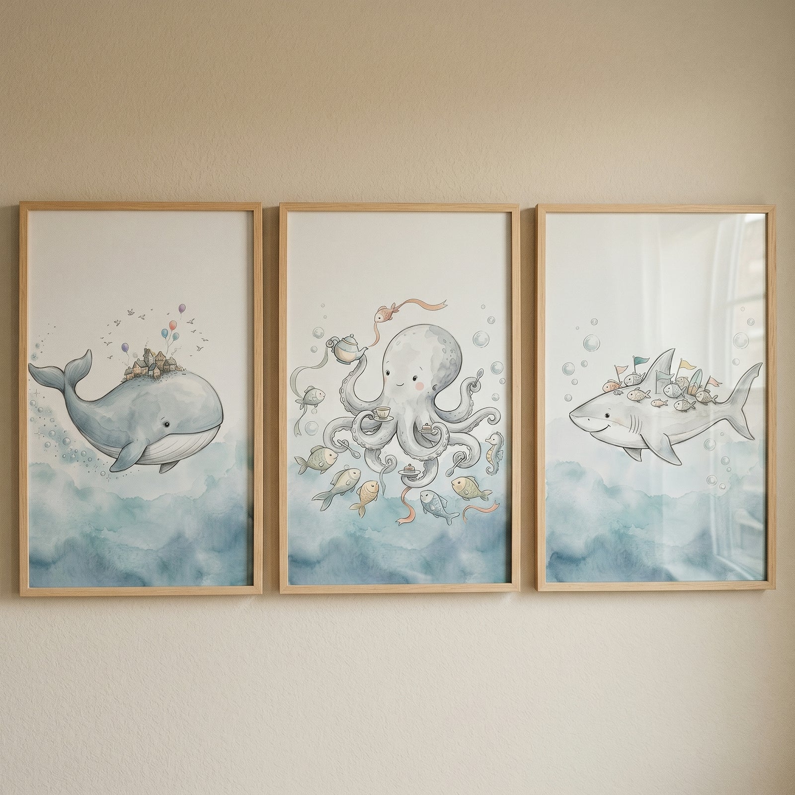 Misty blue ocean animal wall art set of 3 featuring a watercolor whale, octopus, and shark in wood frames.
