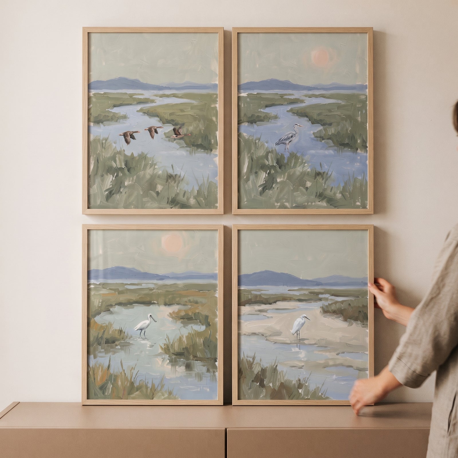 Misty green coastal bird wall art set of 4 featuring serene wetland scenes with various birds in light wood frames.