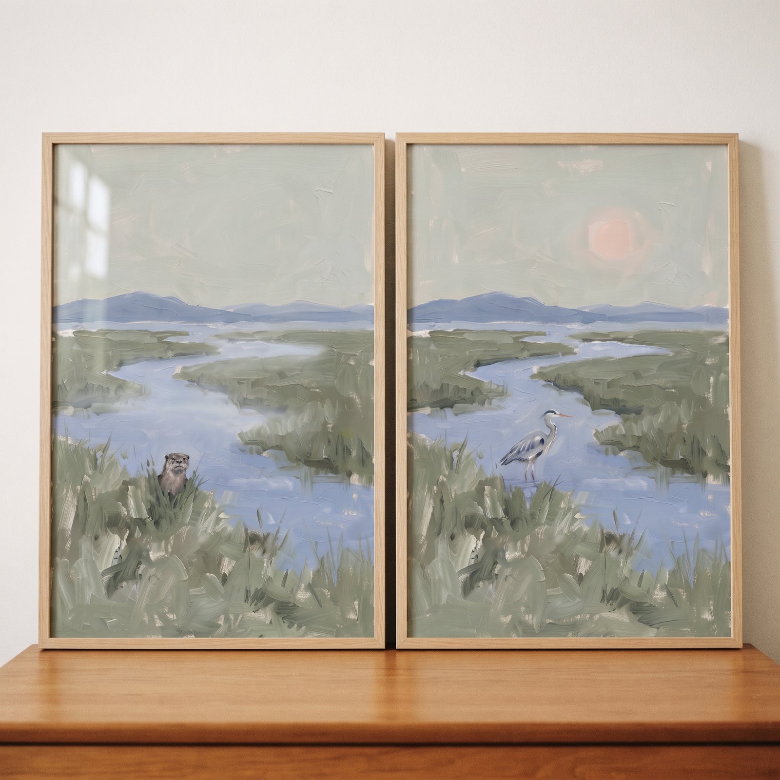 Misty green wetland wildlife animals wall art set of 2 featuring an otter and heron in a marshy river landscape.