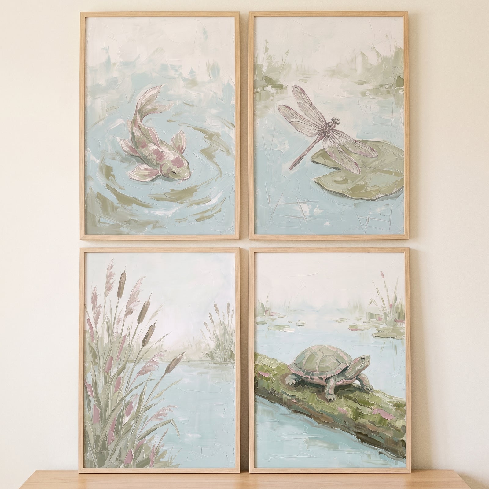 Misty sage pond animals wall art set of 4 with a koi, dragonfly, reeds, and a turtle in muted tones and light wood frames.