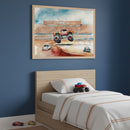 Kid's bedroom with a light wood bed against a blue wall. A large framed watercolor art of a monster truck jumping over cars in a stadium hangs above the bed. Toy cars are on the floor and bed.