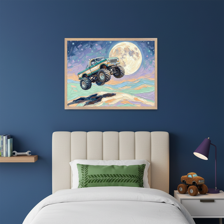Kid's bedroom with a cream upholstered bed against a blue wall. Centered above the bed hangs a large framed textured painting of a green monster truck jumping over wavy terrain under a full moon. A purple lamp and a plush monster truck toy are on the bedside table.