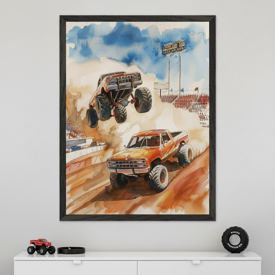 Modern room with a white dresser. A large black-framed watercolor painting of two monster trucks, one jumping, racing at a stadium, hangs centered above the dresser. A red toy monster truck and a decorative monster truck tire are on the dresser.