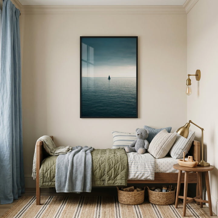 Cozy bedroom featuring a wooden bed, blue curtains, and moody teal sea sailboat wall art on a neutral wall.