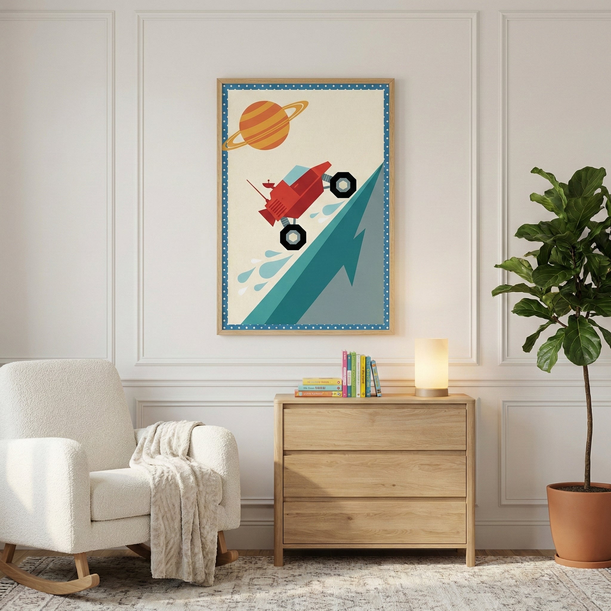 A well-lit interior features a white textured rocking chair draped with a light-colored throw blanket. A wooden three-drawer dresser sits against a paneled white wall, holding a small collection of books and a glowing cylindrical table lamp. Above the dresser, a framed illustration depicts a stylized red vehicle driving up a sharp blue incline, set against an off-white background with a ringed celestial body and a dotted border. To the right, a large leafy green plant in a terracotta-colored pot stands on a