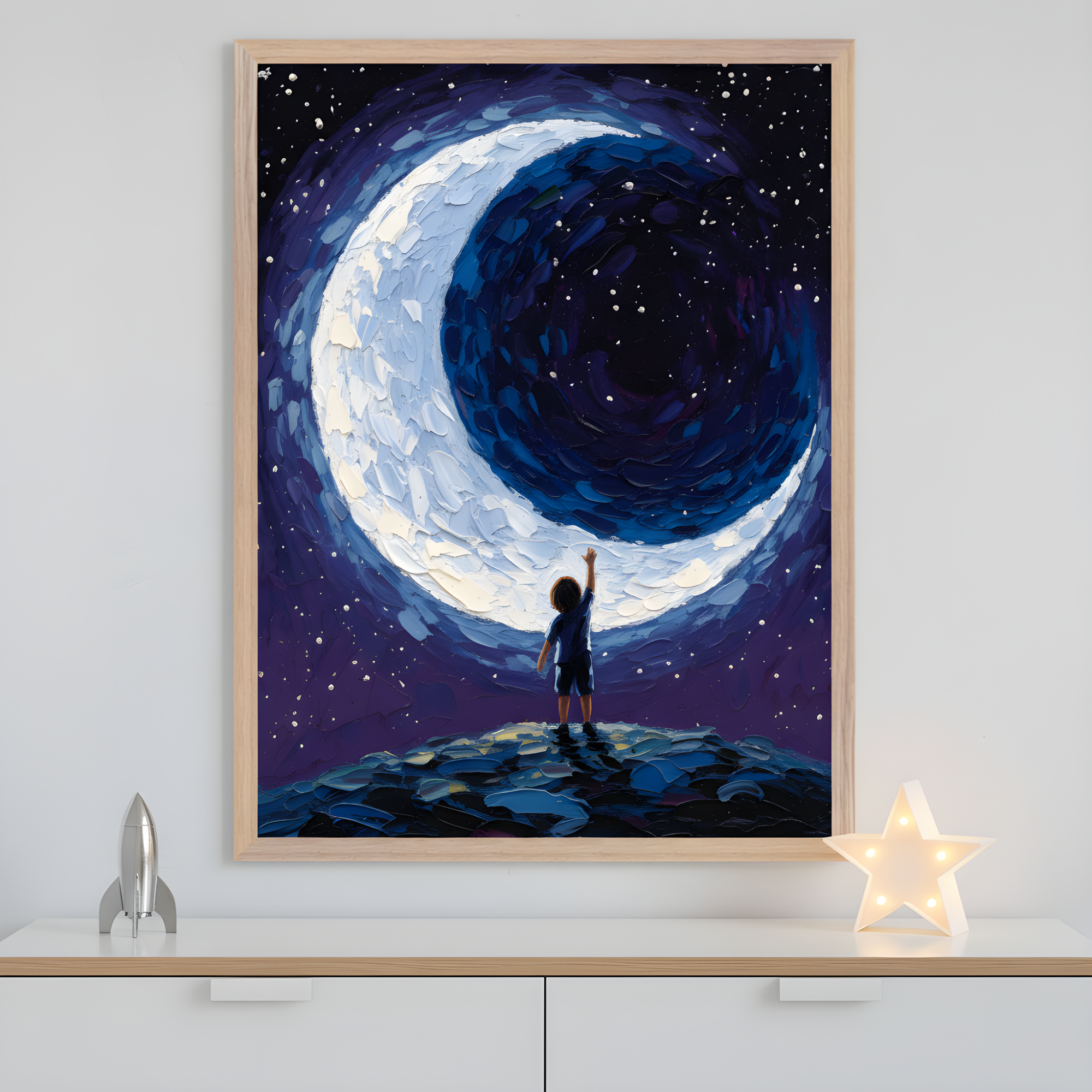 This framed artwork shows a child standing on a rocky hill, reaching toward a swirling crescent moon surrounded by a starry night sky. The thick, textured brushstrokes in deep blues, purples, and whites create a dreamlike, imaginative atmosphere that evokes wonder and curiosity.