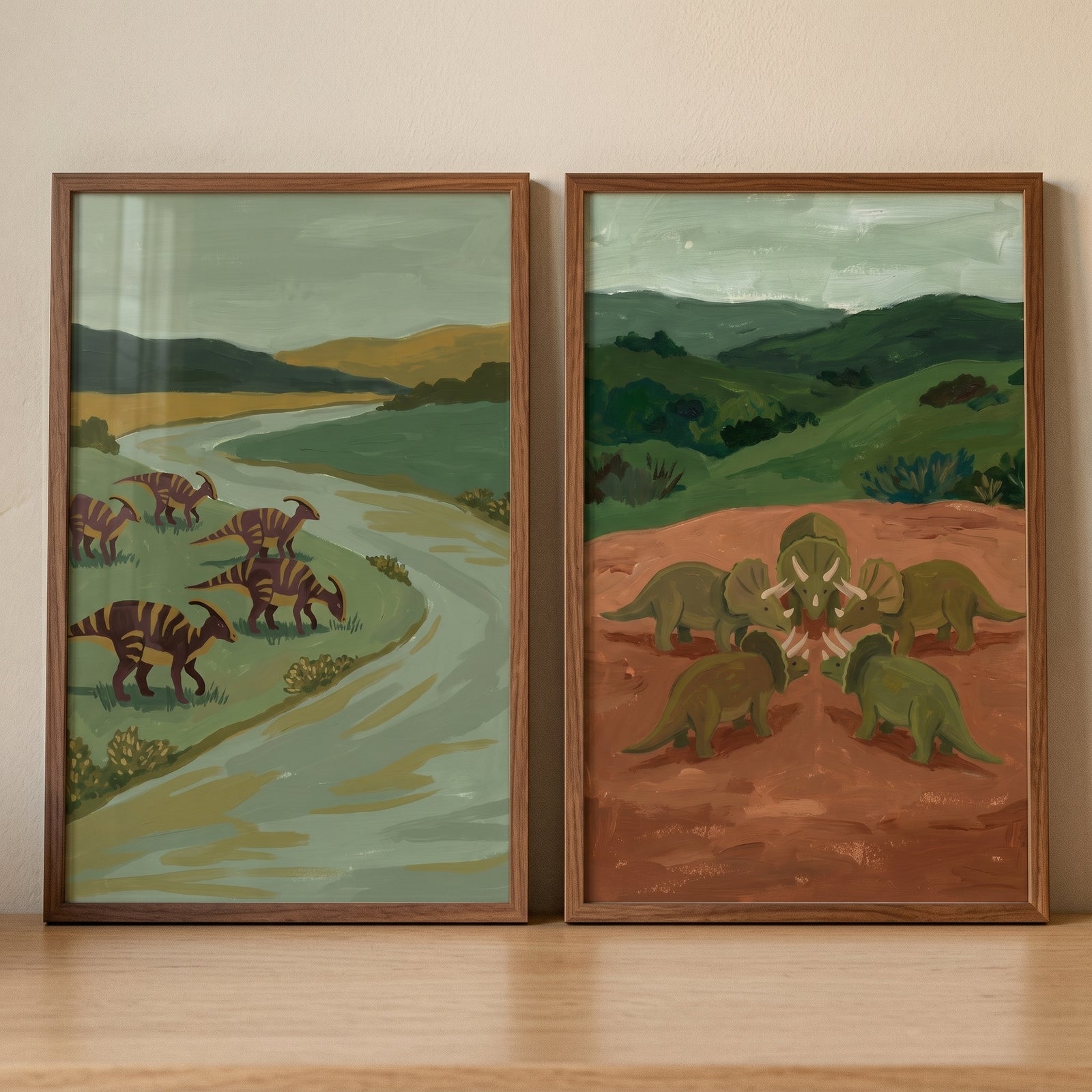 Moss green primitive dinosaur wall art set of 2 depicts prehistoric herds roaming river and hilly landscapes.
