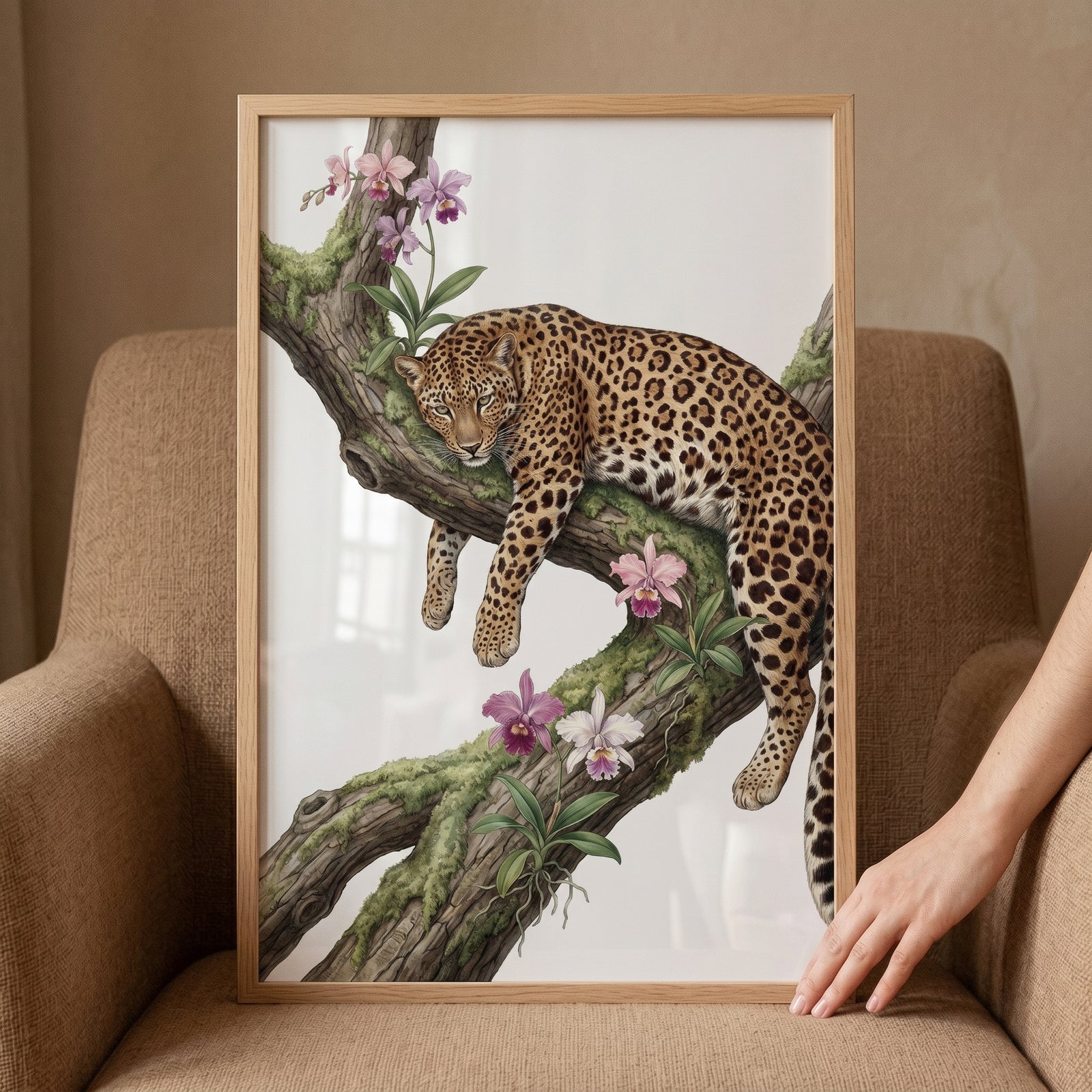 Framed mossy branch orchid leopard wall art displays a leopard resting on a tree limb among pink orchids and green moss.
