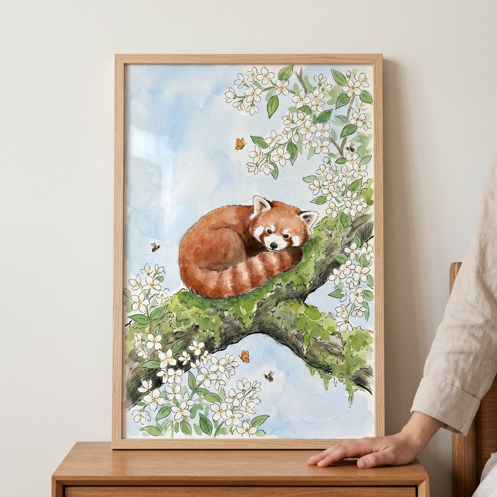 Mossy branch red panda wall art depicts a curled animal resting on a flowered limb among butterflies and bees.