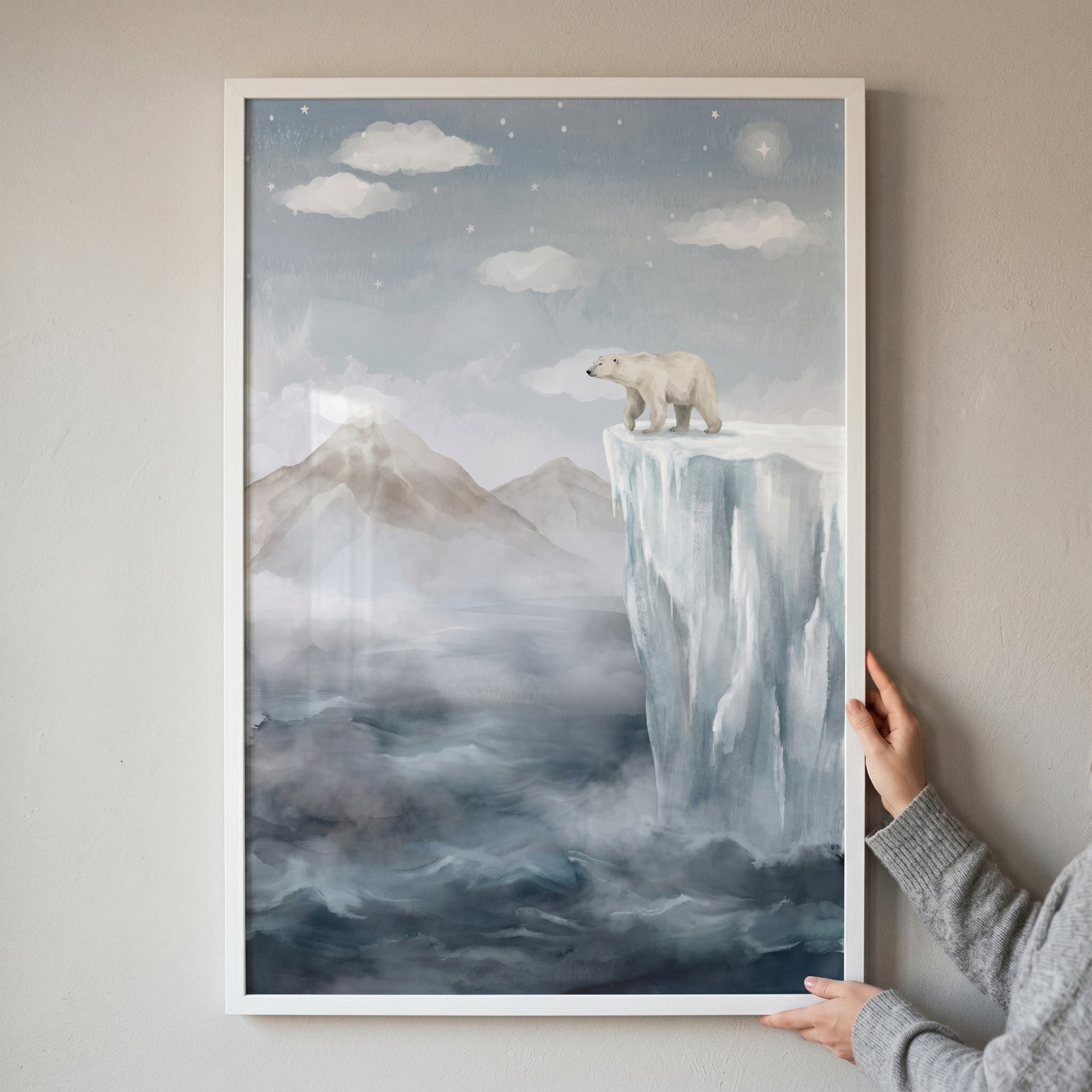 Mountain polar bear wall art showing a polar bear on an ice cliff above a misty sea with distant mountain peaks.