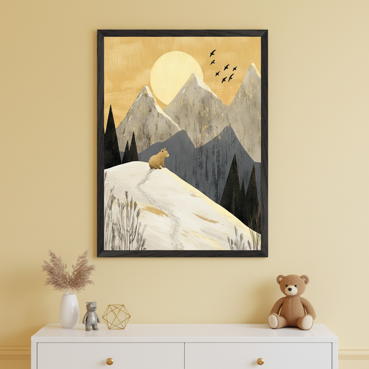 Modern kid's room with a white dresser. Above it, a framed, stylized landscape painting shows a brown bear on a snowy hill with dark trees, grey mountains, a large golden sun, and flying birds.