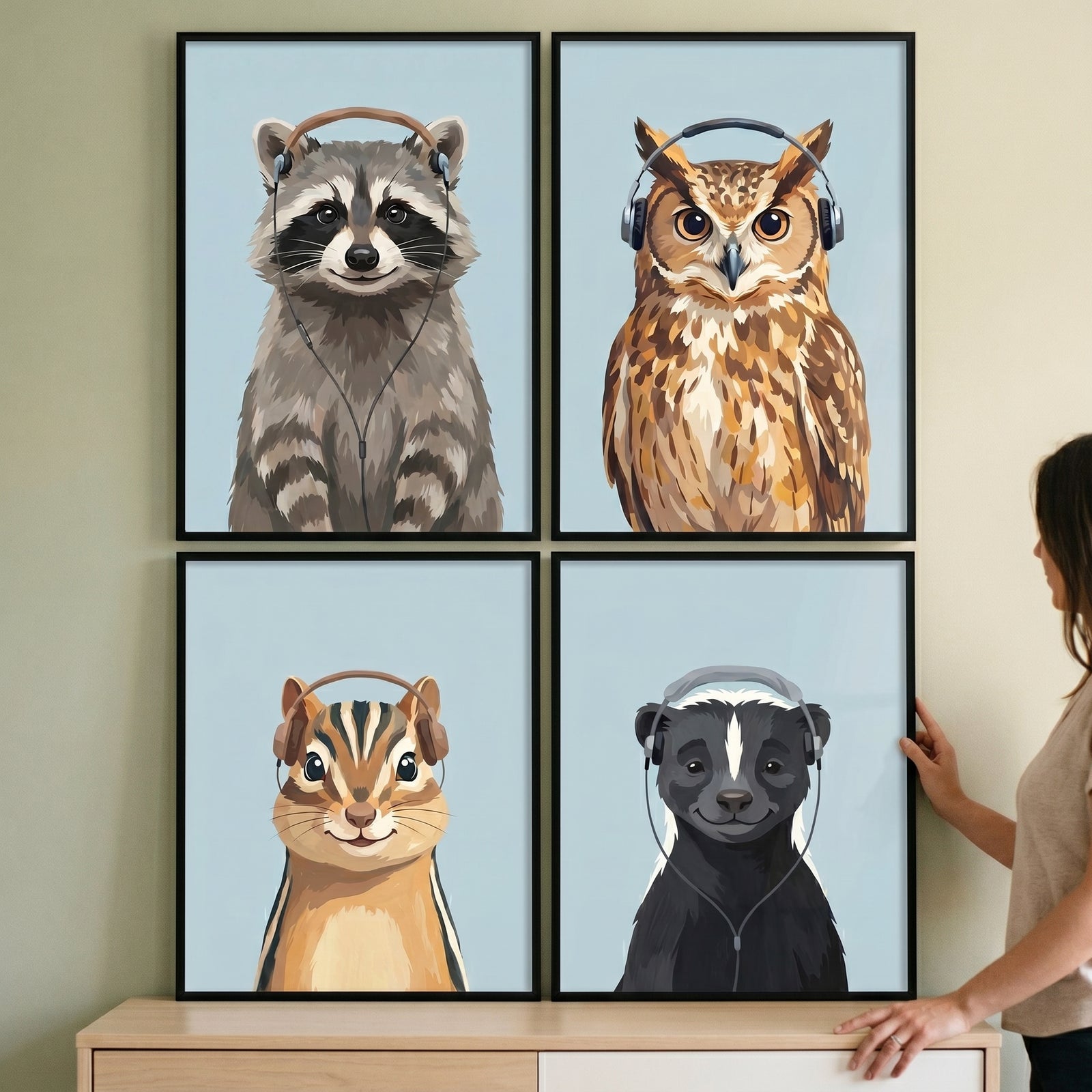 Music listening woodland animal wall art set of 4 featuring a raccoon, owl, chipmunk, and skunk wearing headphones.