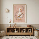 Cozy nursery shelf styled beneath a framed illustration of a duck playing a guitar with musical notes swirling around it on a soft pink background. Wooden toys, alphabet blocks, a small drum, and plush decor sit neatly arranged below, reinforcing a gentle music themed nursery setting.