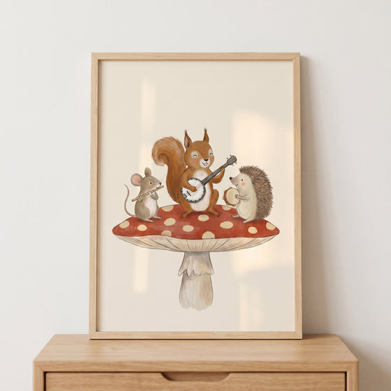 Musical woodland animals wall art with a mouse, squirrel, and hedgehog playing music on a red mushroom.