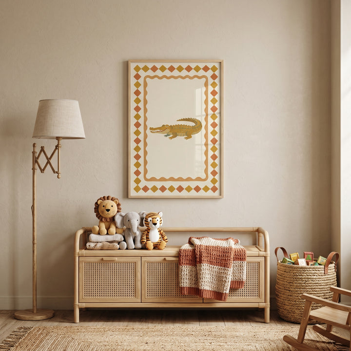 Mustard diamond border crocodile wall art hangs above a rattan storage bench with stuffed toys and a blanket.