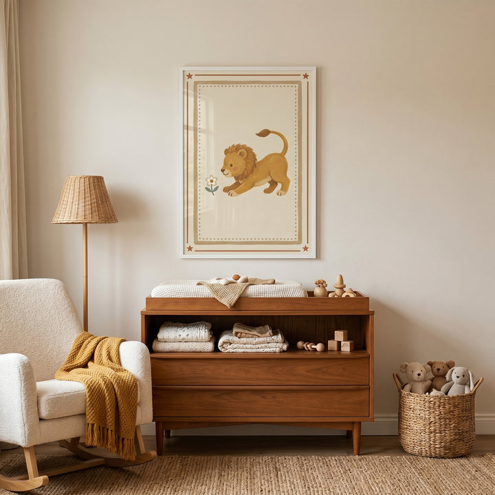 Mustard yellow mane lion wall art hangs above a wooden dresser in a warm nursery with a white rocking chair and lamp.