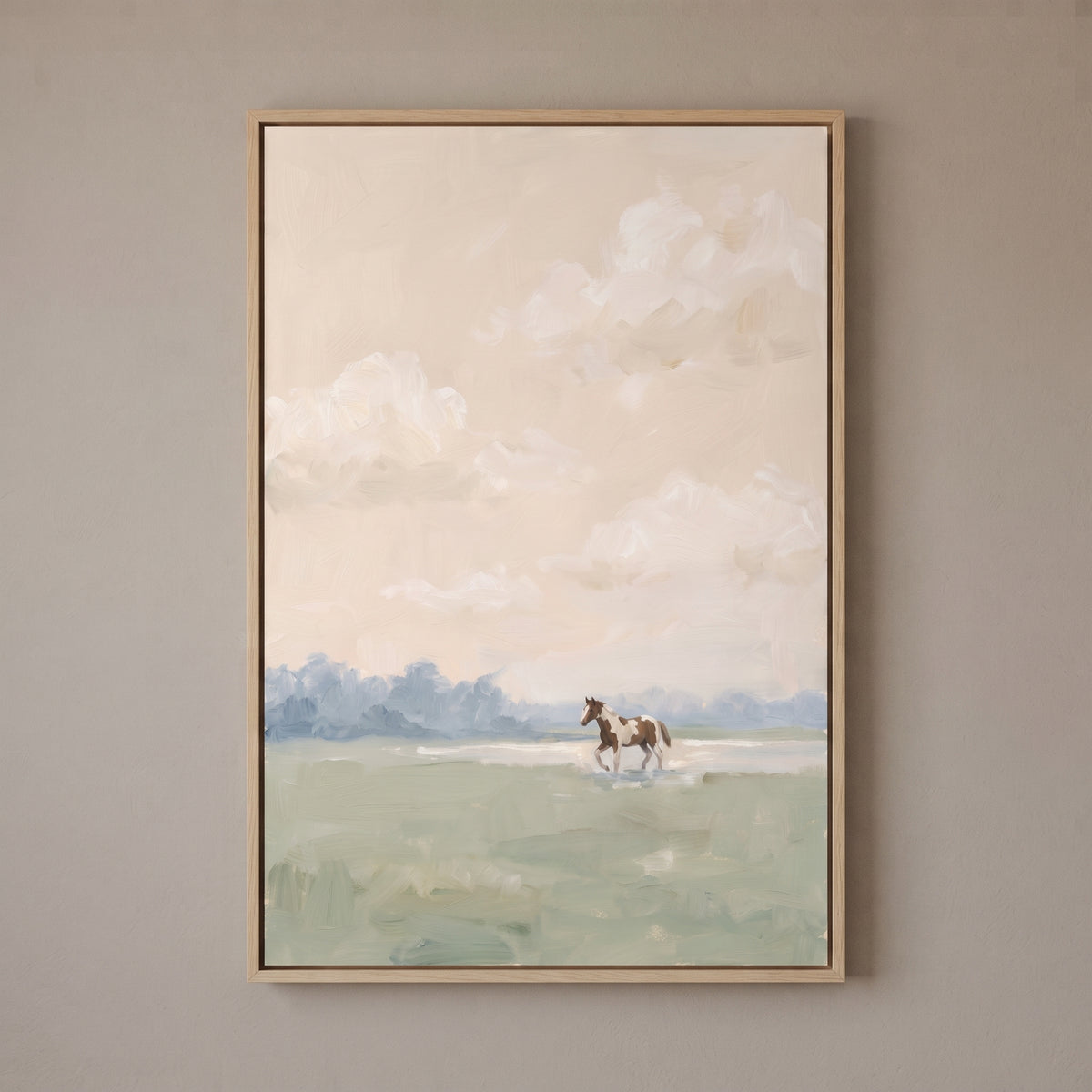 Muted blush pinto horse wall art featuring a brown and white horse in a light green field under a soft cloudy sky.`