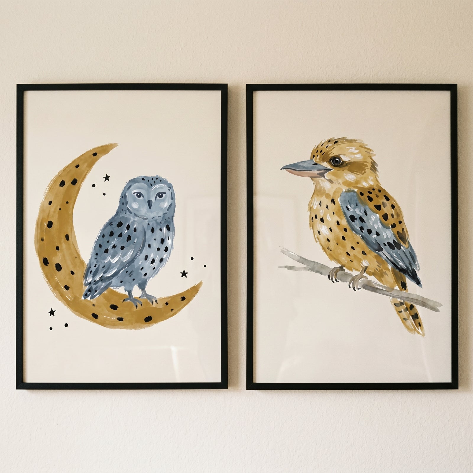 Muted earth tone birds wall art set of 2 with a blue owl on a crescent moon and a speckled brown bird on a branch.