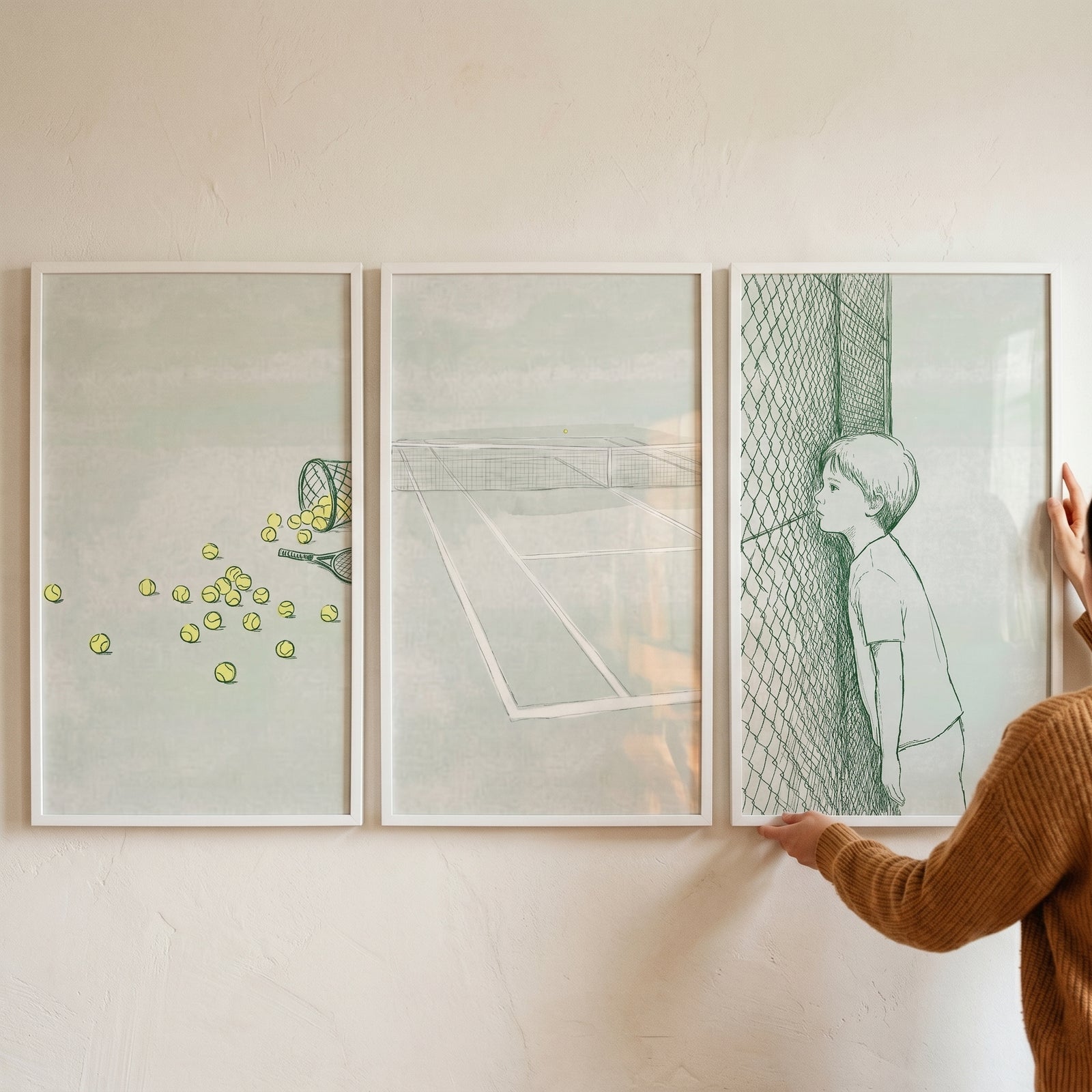 Three panel collage of minimalist line illustrations showing scattered tennis balls beside a racket, an empty tennis court viewed from center, and a young boy leaning against a fence, with a person’s hands adjusting the framed artwork on a wall.