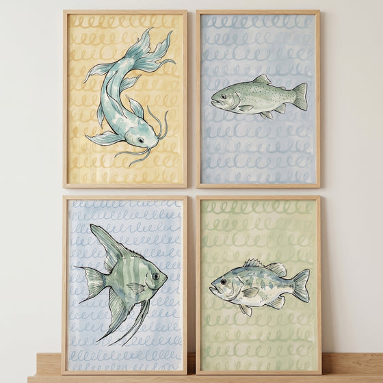 Muted pastel watercolor fish wall art set of 4 featuring four different fish species in light wood frames.