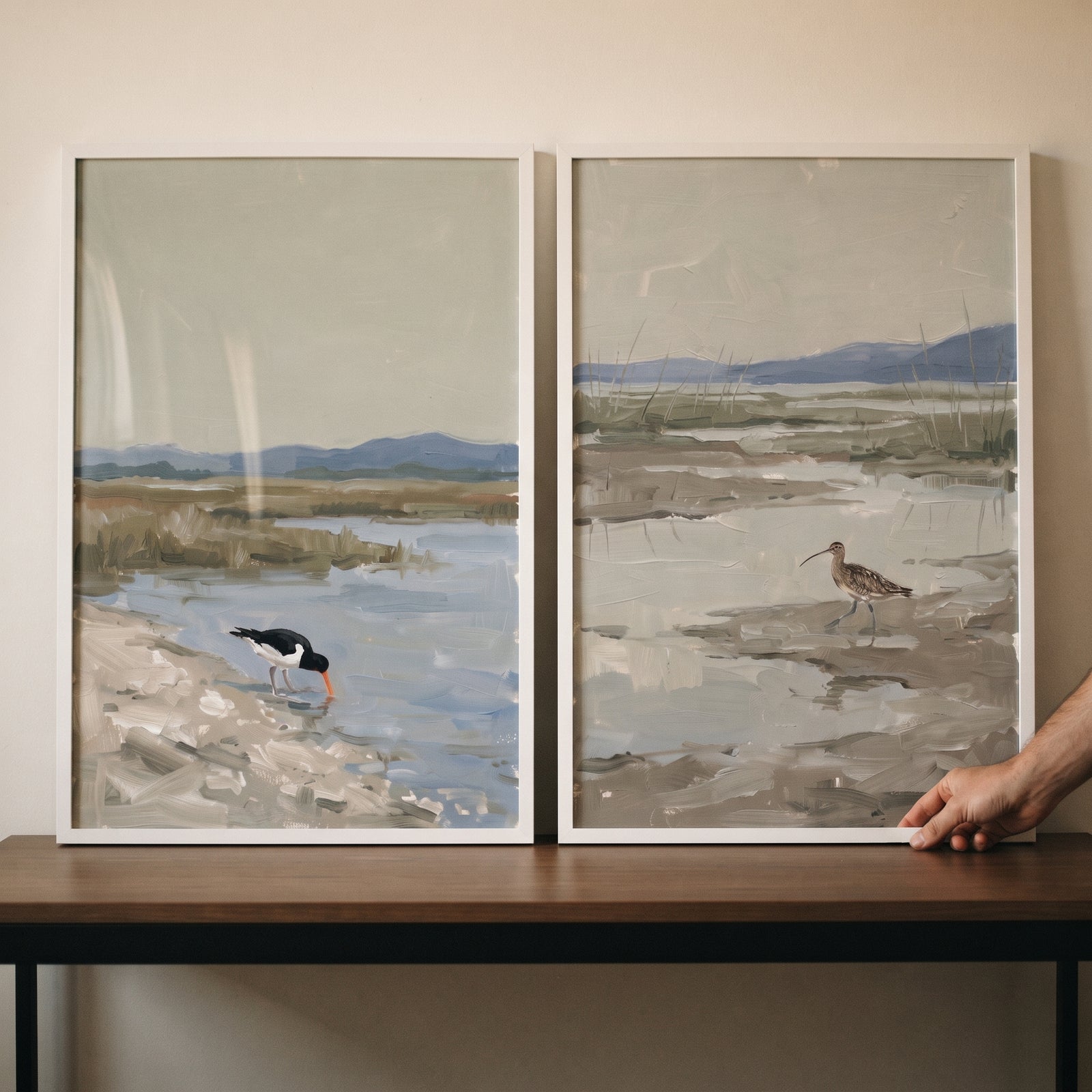 Muted sage coastal bird wall art set of 2 features an oystercatcher and curlew in a marshy landscape with white frames.