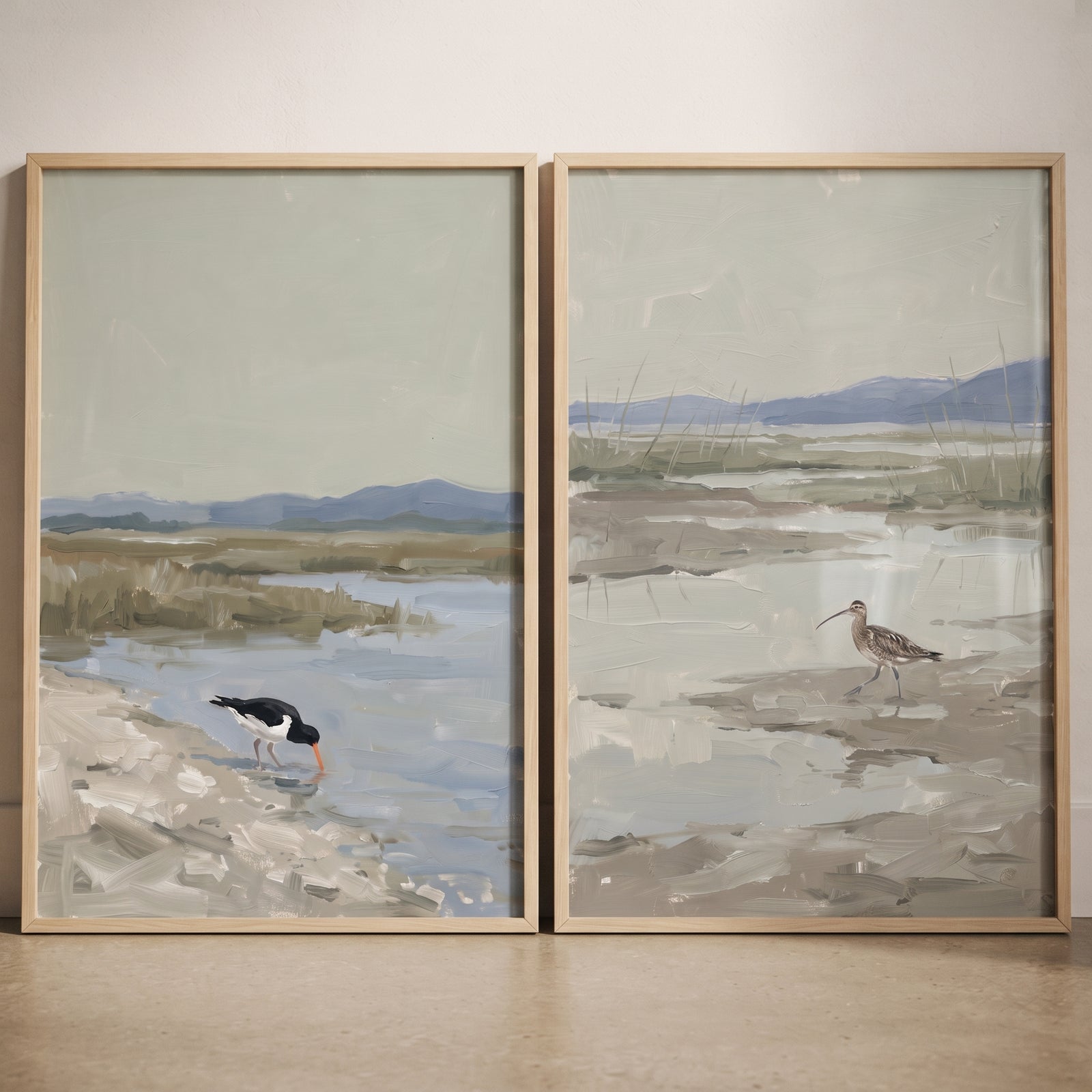 Muted sage coastal shorebird wall art set of 2 in light wood frames shows birds in a hazy marshland landscape.